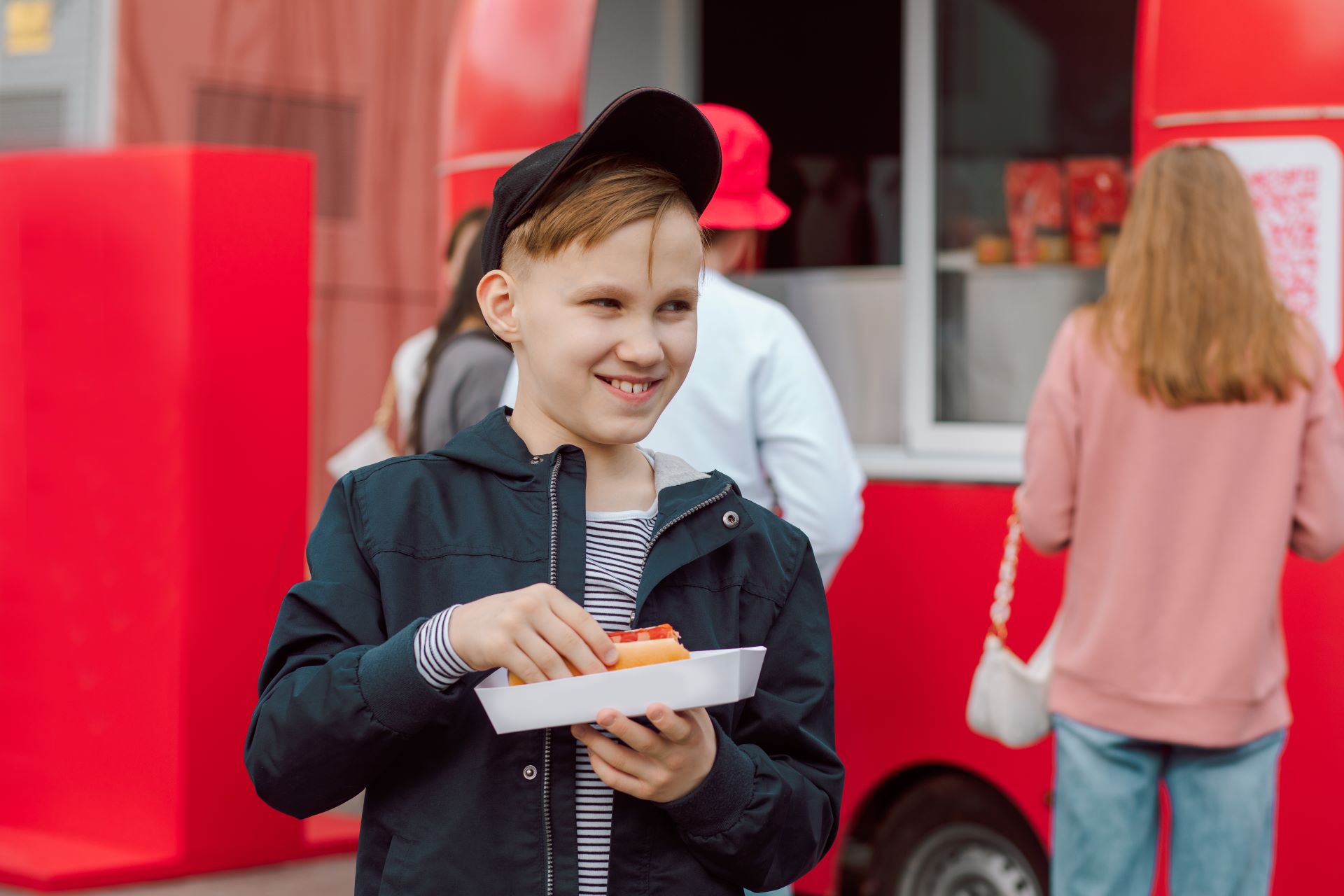 cute-teen-boy-kid-eating-hot-dog-nearby-food-track-2024-12-06-18-02-10-utc