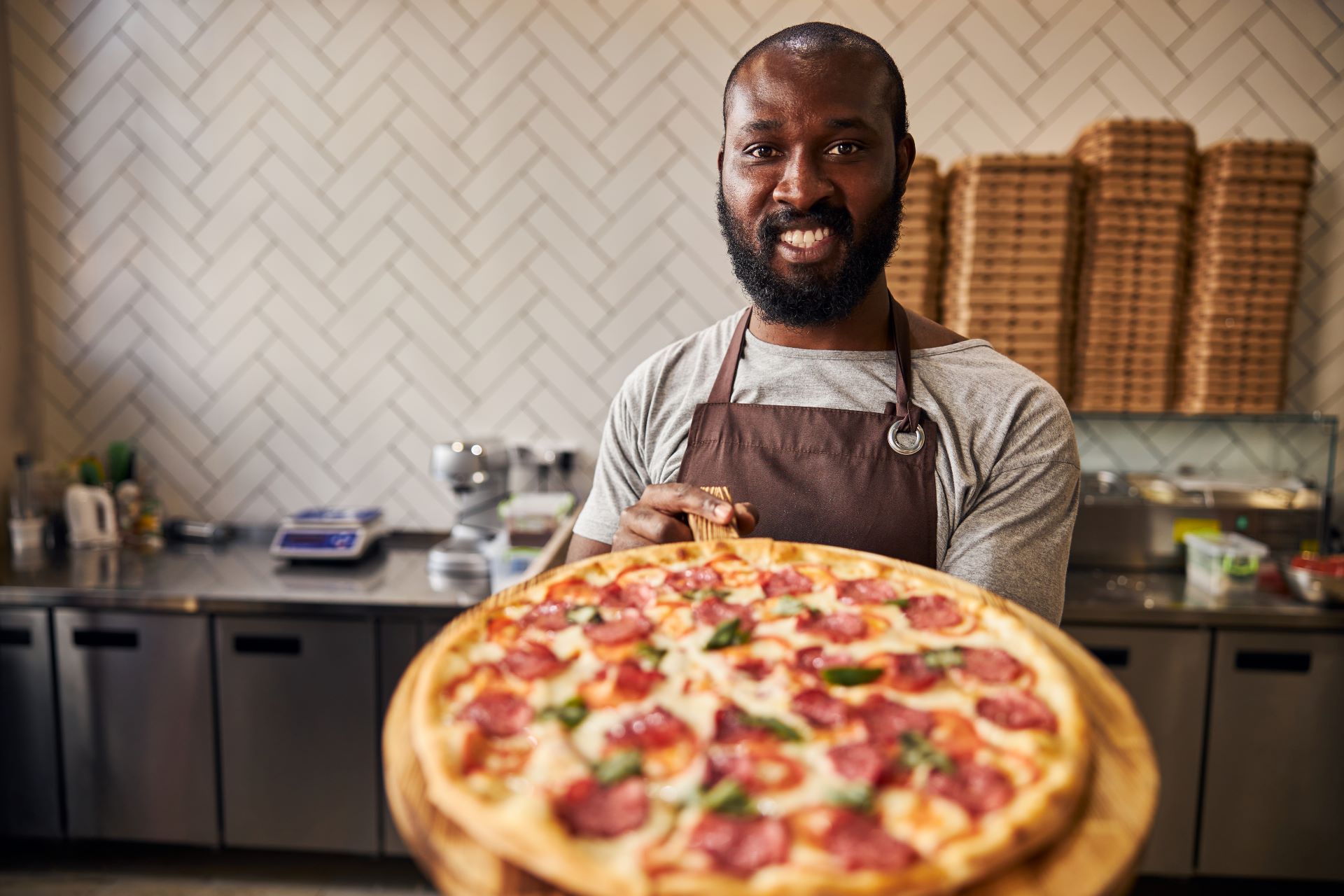 joyful-afro-american-man-holding-wooden-board-with-2025-03-08-09-56-06-utc