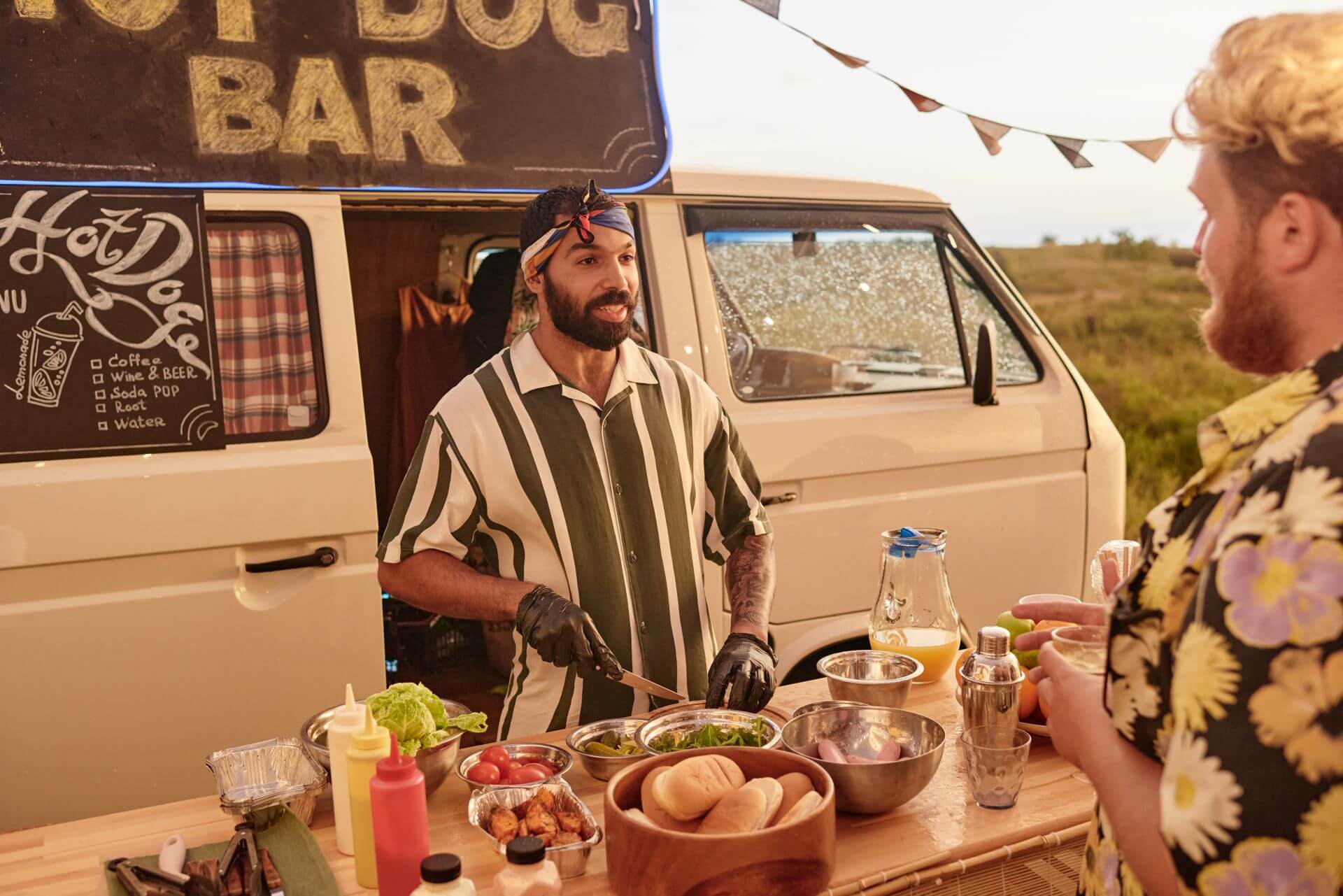 man-preparing-sandwiches-at-party-2025-02-11-15-36-46-utc